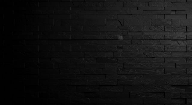 Black brick wall background with light photo