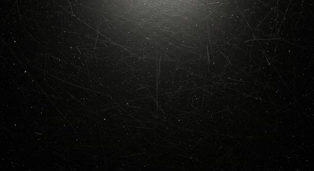 Black background with a light shining through it photo