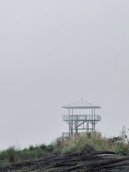 Solitary Observation Tower in Foggy Landscape photo