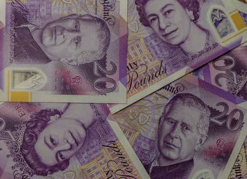 Explore the intricacies of British currency featuring portraits of royalty and vibrant designs in close-up view photo
