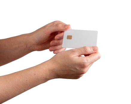 Young female hand holding a blank credit card, showcasing promotional offers, banking services, and photo