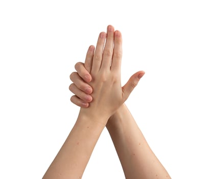 Female hands with well-groomed, shiny nails, demonstrating perfect manicure and skincare. photo