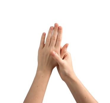 Female hands with well-groomed nails, gently spread and showing a glossy, elegant manicure. photo