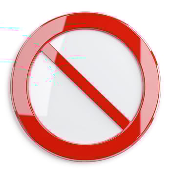 A bold red prohibition sign symbolizing restriction or ban on actions. photo