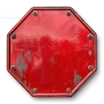 Close-up of a weathered red stop sign with scratches, showcasing wear and tear over time. photo