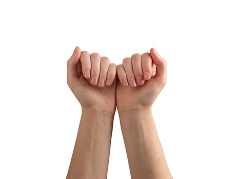 Female hands with glossy, polished nails, gently gesturing and demonstrating self-care and wellness. photo
