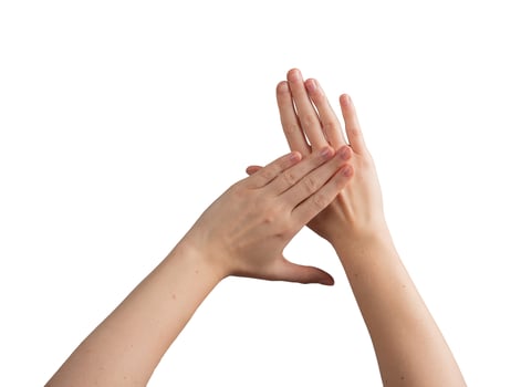 Female hands gently positioned to show off a polished, glossy manicure, symbolizing beauty, photo