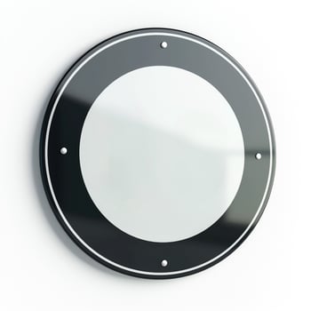 A sleek, modern circular wall mirror with a black frame, reflecting minimalistic design elements. photo