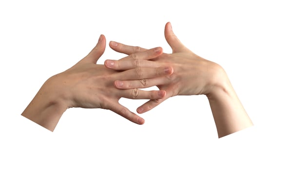 Female hands elegantly intertwined, showcasing beautifully groomed nails and smooth, soft skin. photo