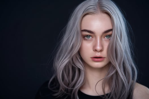 A woman with gray hair and green eyes photo
