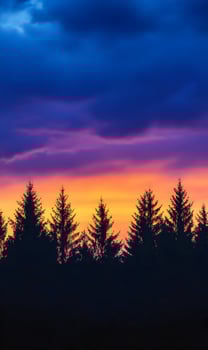 Enchanting twilight sky over the forest with vibrant colors and dramatic clouds scenery photo