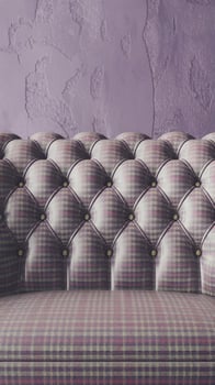 A purple couch with a checkered pattern photo