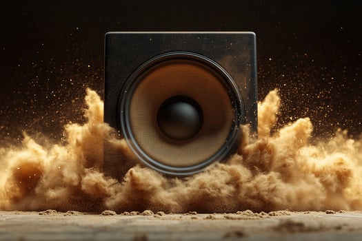 Dynamic speaker erupting dust and particles in dramatic sound wave imagery photo