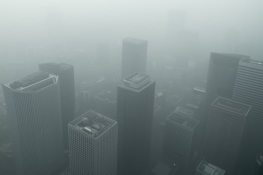 Foggy cityscape overlooking skyscrapers in a misty urban landscape photo