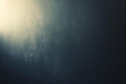 A textured gradient of dark blues and subtle light, creating a moody, abstract background. photo
