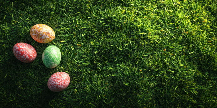 Colorful Easter eggs scattered on green grass in a sunny spring day photo