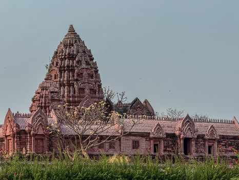 Stunning temple with detailed carvings amid vibrant foliage photo