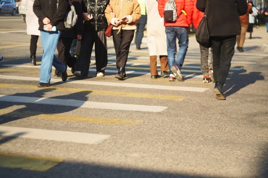 People Crossing Street at Pedestrian Crosswalk photo