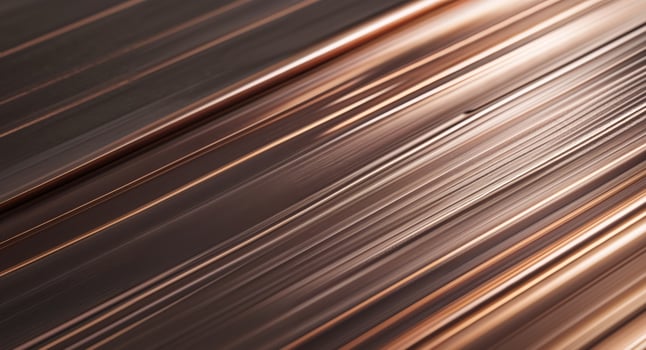 A close up of a copper metal surface photo