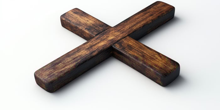 Rustic wooden cross resting on a light surface highlighting its texture and craftsmanship photo