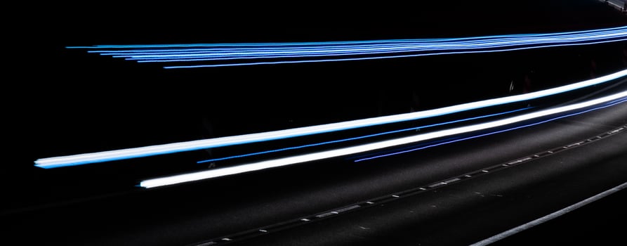 white and blue lights of cars with night photo