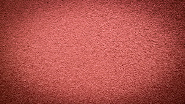 the wall is painted with red paint with visible details photo