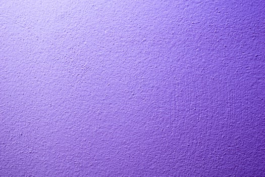 the wall is painted with purple paint with visible details photo