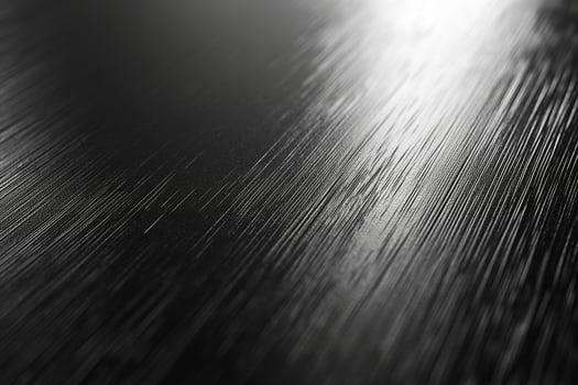 Close-up of a sleek, brushed metal surface showcasing an elegant texture. photo