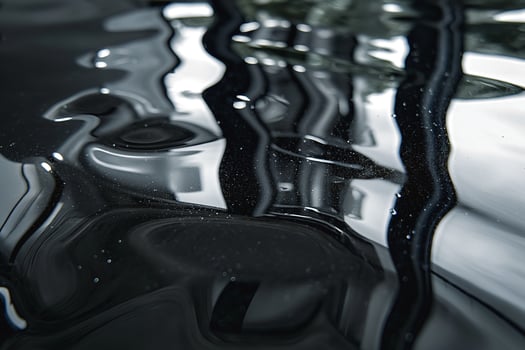 Abstract close-up of dark water with ripples and reflections, creating a serene and tranquil atmosphere. photo