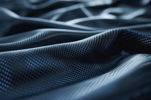 Close-up of textured black fabric showcasing wavy patterns and sheen. photo