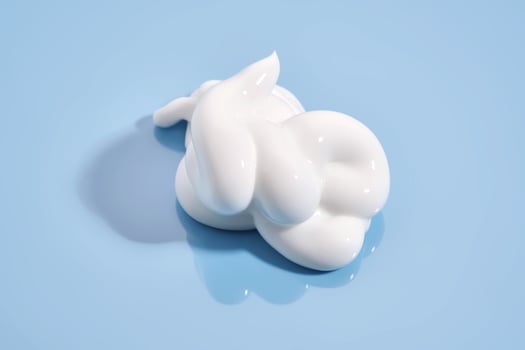 The texture of white cream on a blue background. photo