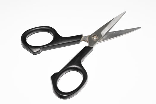 scissors with a black handle on a white background photo