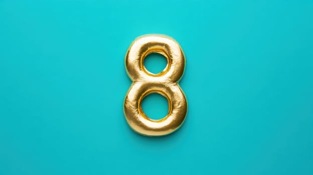 Golden number eight on a bright turquoise background creating a vibrant and eye-catching visual for celebrations or decor photo