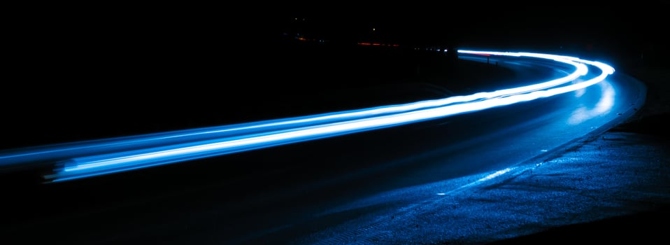 blue and white car lights at night. long exposure photo