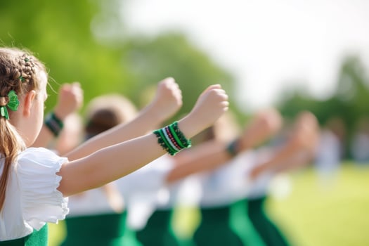 Dancers in traditional attire celebrate with joyful movements outdoors photo