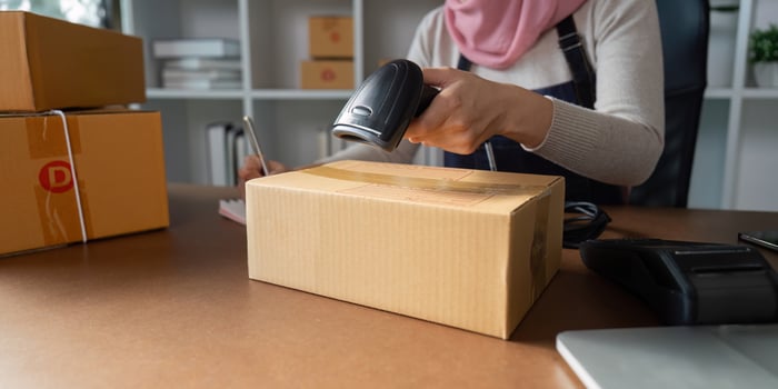 Scanning a package for online order fulfillment photo