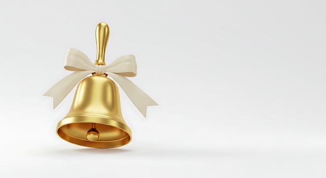 A golden bell with a white bow on it photo