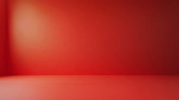 The room is a large, empty space with a red wall. The walls are bare and there is no furniture or decoration. The room has a minimalist feel to it, with the red wall serving as the only focal point photo
