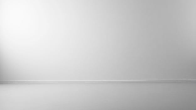 Minimalist white room with subtle light gradient, ideal for showcasing products or creating a serene atmosphere photo