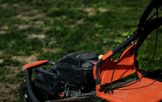 Red Lawn mower cutting grass photo
