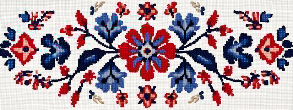 A cross stitch pattern with red, blue and white flowers photo