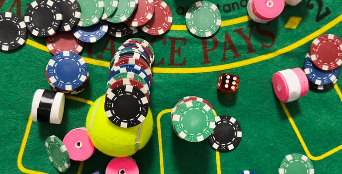 Poker chips and tennis ball photo
