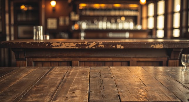 Cozy vintage saloon atmosphere with rustic wooden table and bar. photo