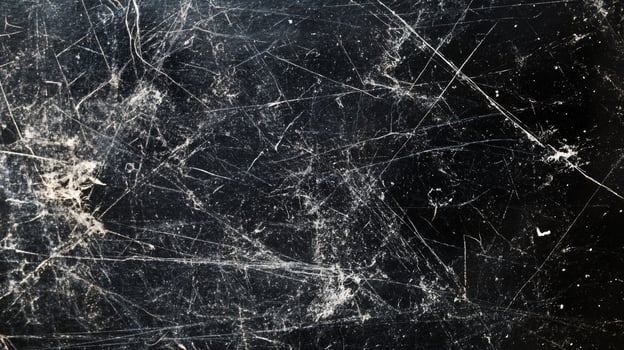 Abstract black surface texture, with scratches and scuffs. Ideal for backgrounds or overlay effects, suggesting age and wear. photo