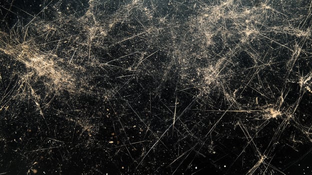 Abstract dark surface with intricate patterns and textures, resembling a distressed or damaged material, creating visual interest. photo