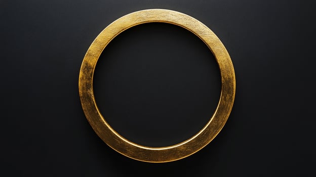 An eye-level close-up presents a golden circle against a black background, offering a minimalist yet striking visual composition. photo