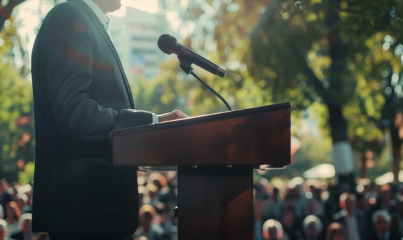 Business seminar and crowd. Businessman with microphone at stage. Politician or director communicate and convention. Leader speech. Male political speaking event photo