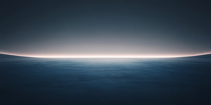 Vast expanse of water meets a serene horizon, bathed in the soft glow of dawn or dusk, evokes tranquility and contemplation. photo