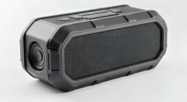 A black portable speaker with a white background photo