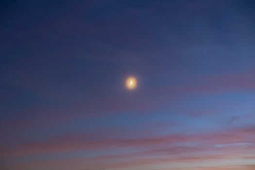 Crescent moon on the hazy sky. Ramadan or islamic concept photo
